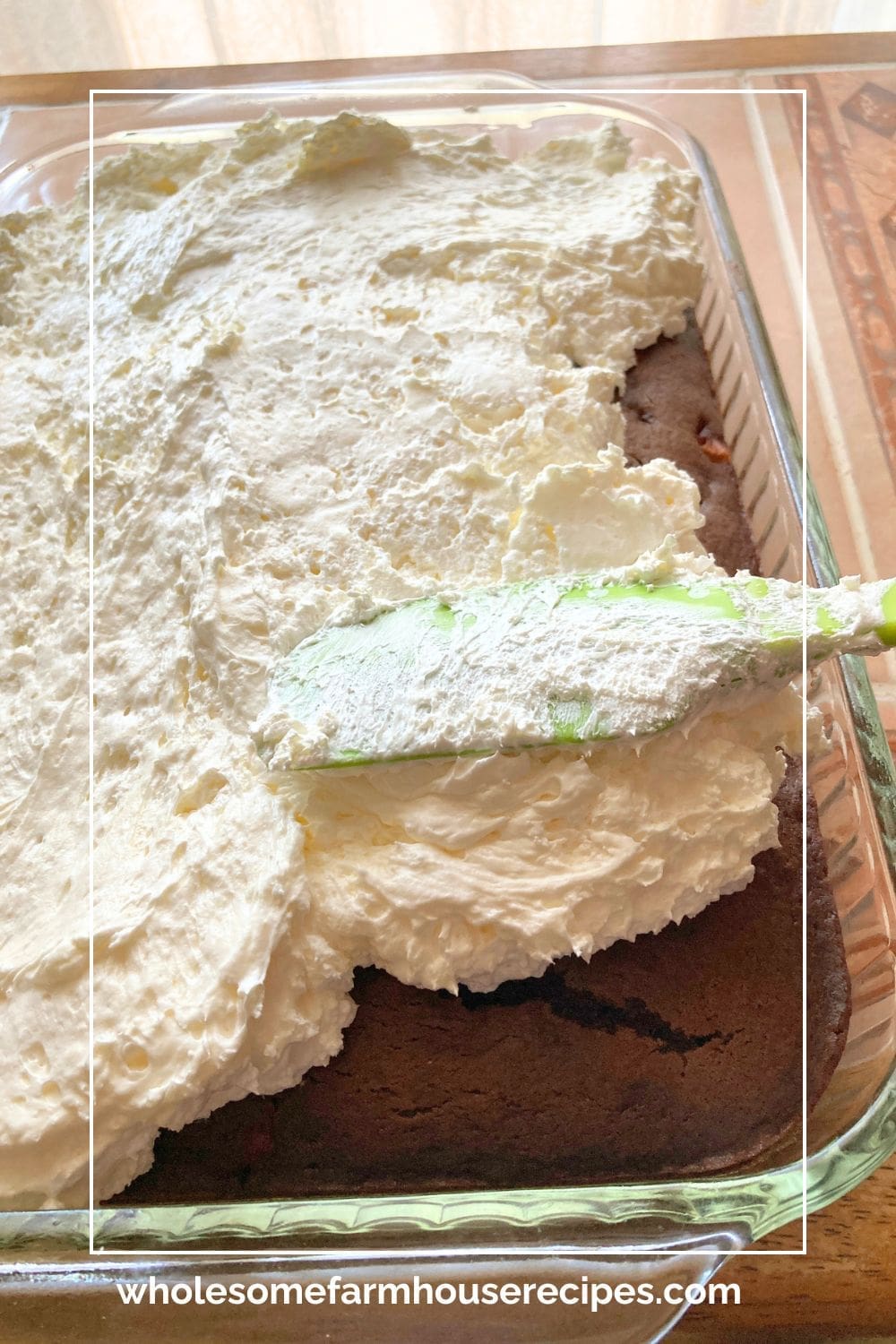Spreading Cream Cheese Frosting on Chocolate Cake